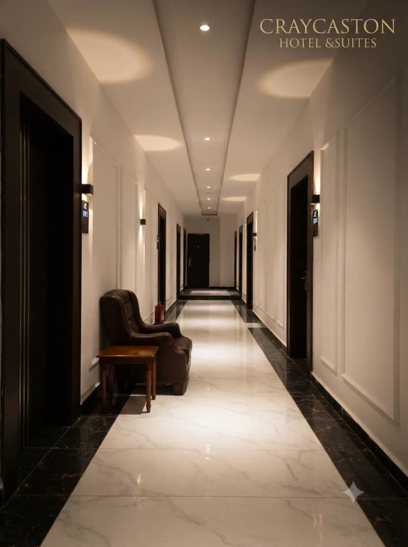 Marble guest corridor lined with keycard room doors